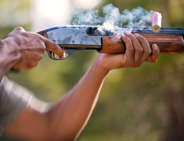 Close up of shotgun fired and shell ejected from chamber
